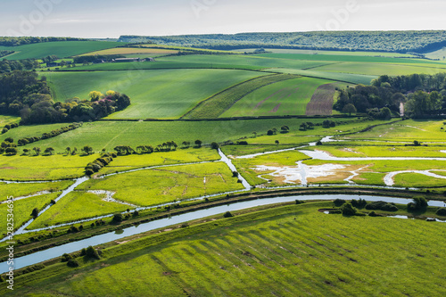 High and over side road view point near Seaford, East Sussex, England. View of Cuckmere river from above, selective focus