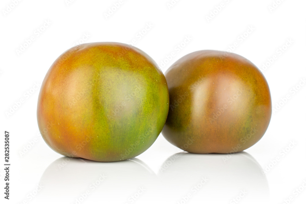 Group of two whole shiny fresh greenish red tomato isolated on white background Group of two whole shiny fresh greenish red tomato isolated on white background