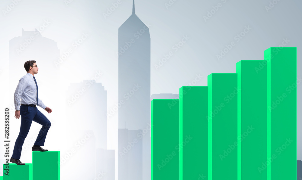 Businessman going up the bar chart in growth concept Businessman going up the bar chart in growth concept