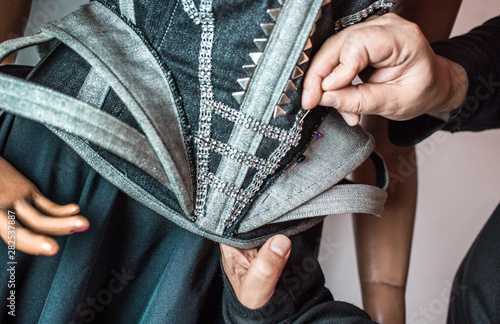 Quadro em tela Fashion designer working on his new creation.