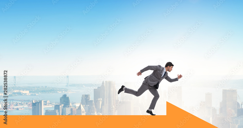 Businessman walking on arrow in business concept