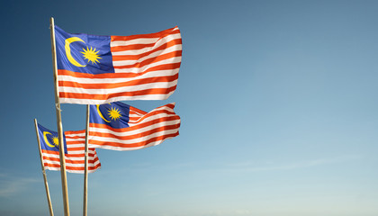 malaysia flags under blue sky independence day concept