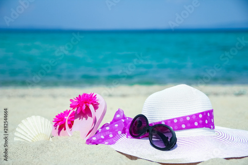 beautiful hat with sneakers by the sea greece on nature background