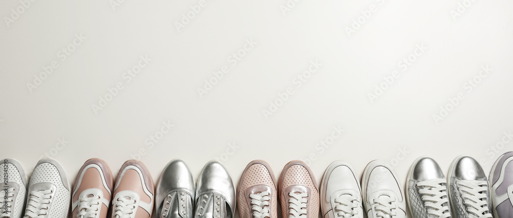 Flat lay composition with stylish shoes on light background. Space for text Flat lay composition with stylish shoes on light background. Space for text