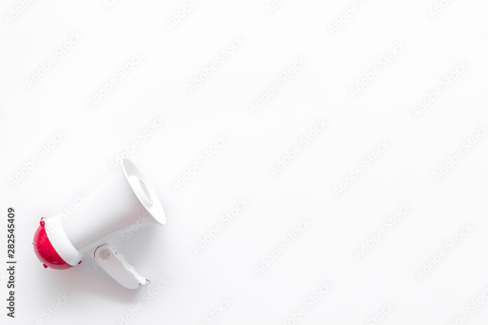 Fototapeta premium Attract attention with megaphone on white background top view copyspace