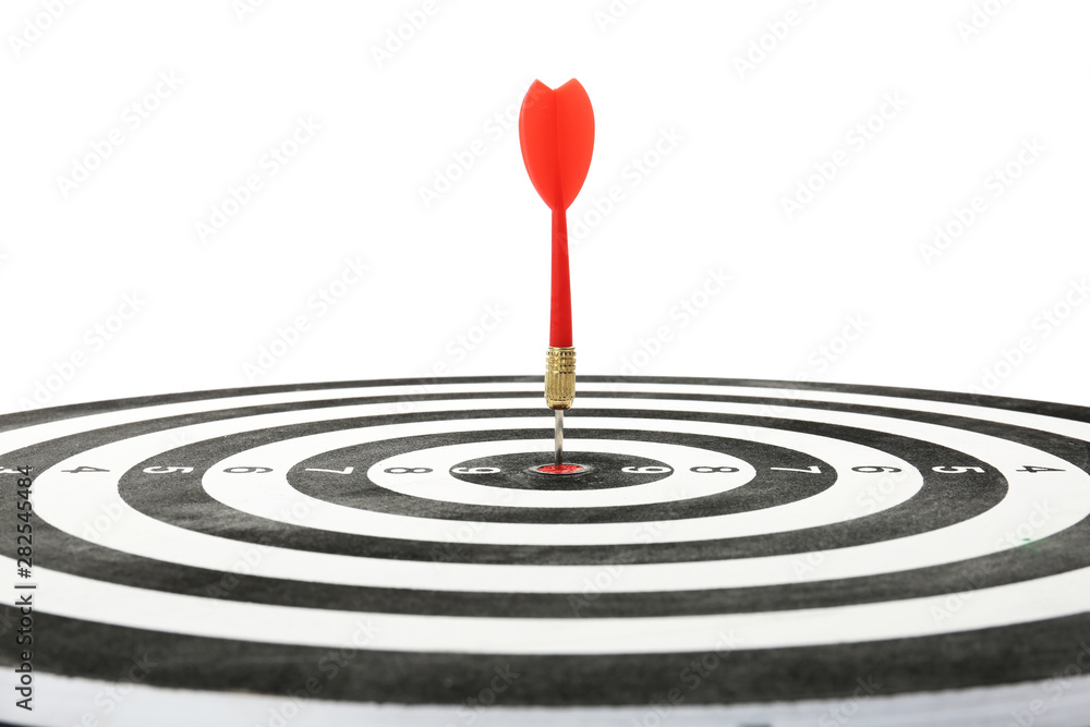 Red arrow hitting target on dart board against white background Red arrow hitting target on dart board against white background