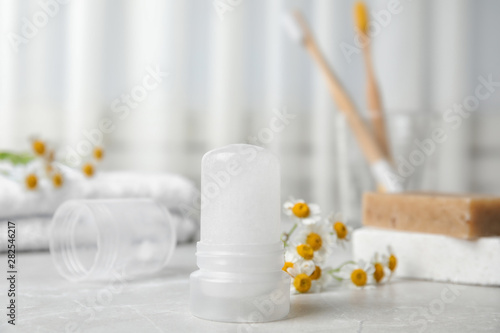Tablou pe pânză Natural crystal alum deodorant on light grey marble background