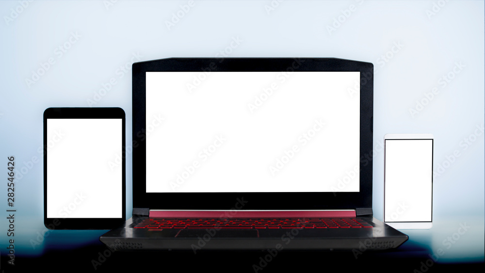 laptop pc, smartphone and tablet on white blank screens laptop pc, smartphone and tablet on white blank screens