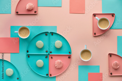 Fotografering Geometric paper background in mint and coral colors with coffee and sweets