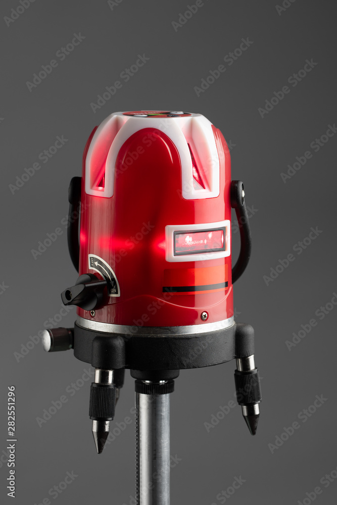 red laser level tool on grey background red laser level tool on grey background