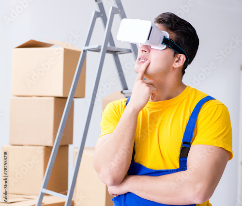 Painter contractor working with virtual reality goggles