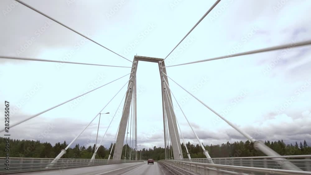 4K POV driving across cable-stayed Kolback bridge in Umeå, Sweden, slowly tilting up at tower 4K POV driving across cable-stayed Kolback bridge in Umeå, Sweden, slowly tilting up at tower