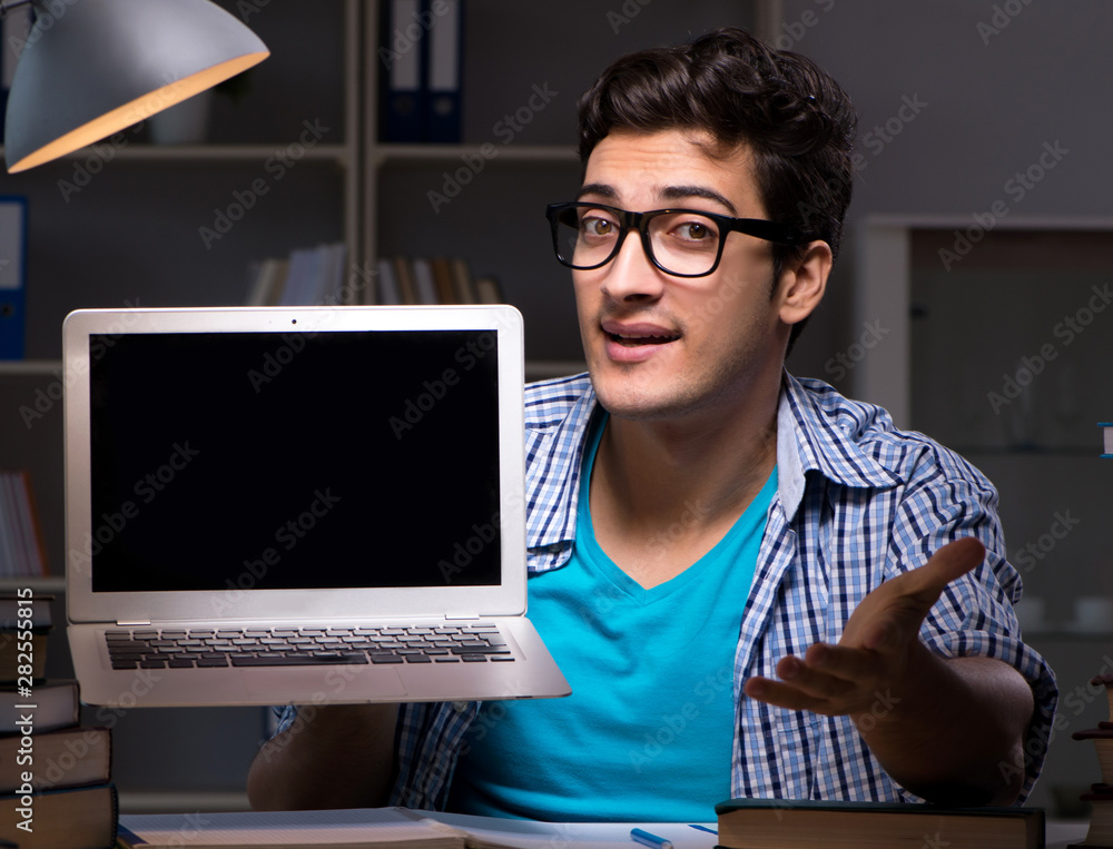 Student preparing for exams late night at home Student preparing for exams late night at home