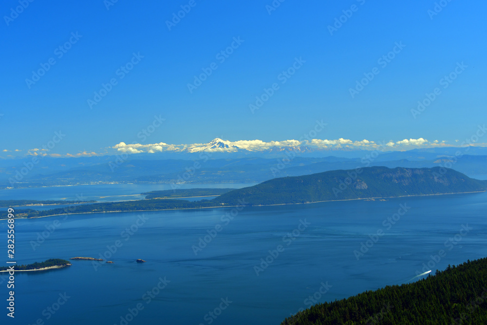 Panoramic view of the San Juan Islands with Mount Baker in the background as seen from Mount Constitution on Orcas Island, Washington Panoramic view of the San Juan Islands with Mount Baker in the background as seen from Mount Constitution on Orcas Island, Washington