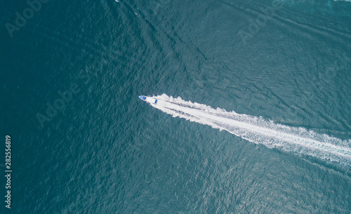 Aerial view on the sea and boat or speedboat. Beautiful natural seascape at the summer time. Island and beautiful beach. blue seascape