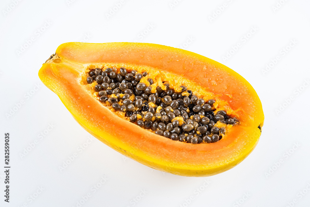 Papaya cut from a fresh fruit on a white background Papaya cut from a fresh fruit on a white background