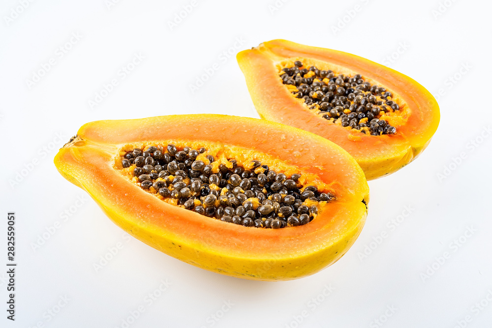 Papaya cut from a fresh fruit on a white background Papaya cut from a fresh fruit on a white background