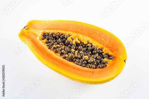 Papaya cut from a fresh fruit on a white background