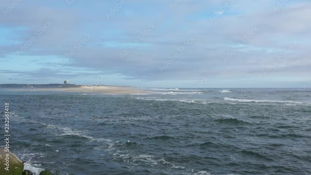 Waves crushing the shore of portugal on a sunset horizon Waves crushing the shore of portugal on a sunset horizon