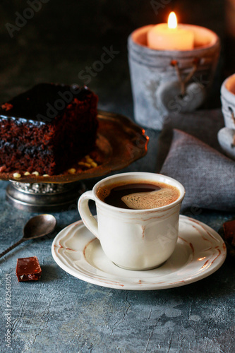 Cup of coffee and traditional brownie with chocolate