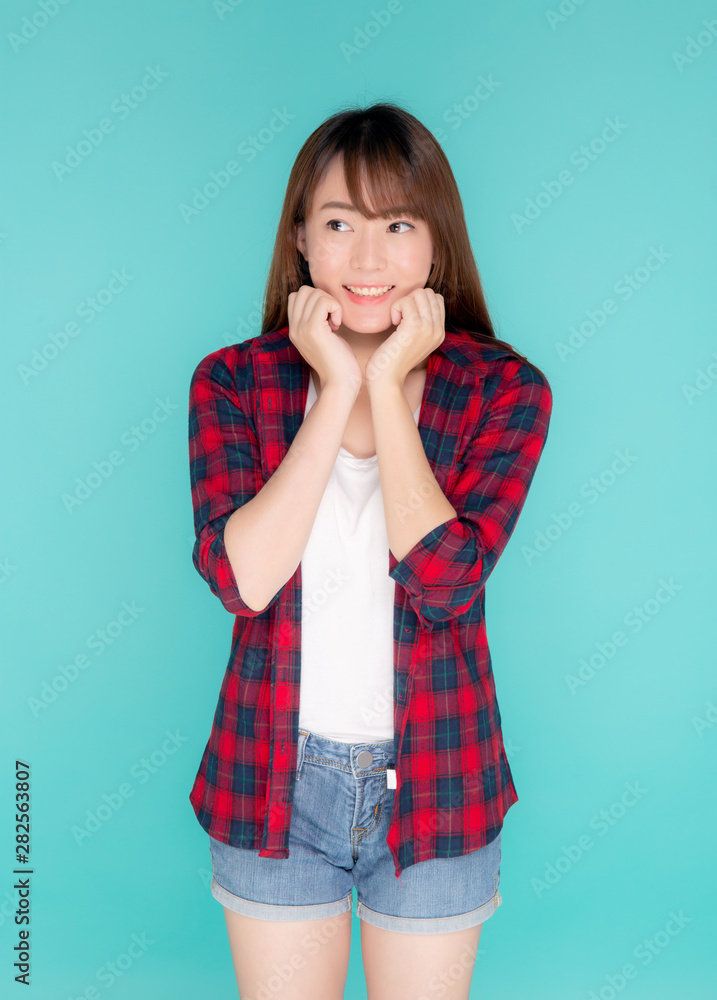Beautiful asian woman smiling and surprise wearing travel summer fashion with tourist in vacation isolated on blue background, girl shocked expression and emotion, tourist, holiday amazing concept. Beautiful asian woman smiling and surprise wearing travel summer fashion with tourist in vacation isolated on blue background, girl shocked expression and emotion, tourist, holiday amazing concept.