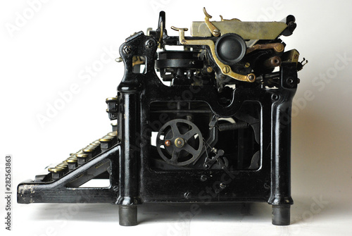 Restored antique typewriter on white background