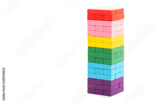 stacked colorful wooden blocks toys on white background. Creative, diverse, expanding, rising or growing.