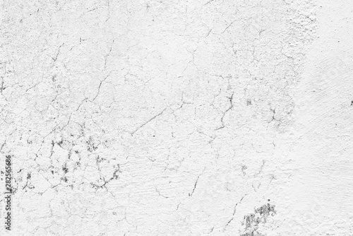 Texture of a concrete wall with cracks and scratches which can be used as a background © chernikovatv