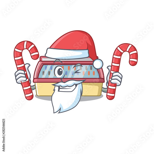 Santa with candy ice cream freezer in cartoon shop
