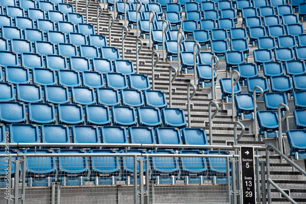 Blue plastic empty stadium  chairs in a row