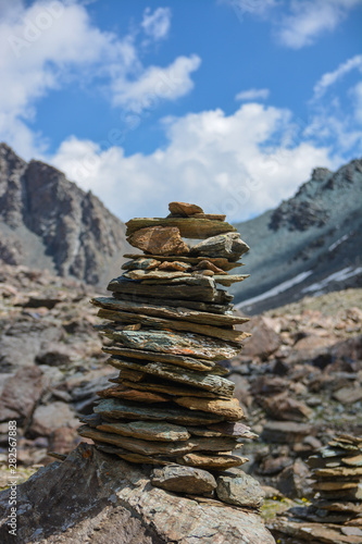 Rock stack at high mountains. Track in the nature. Hiking. © sergfear