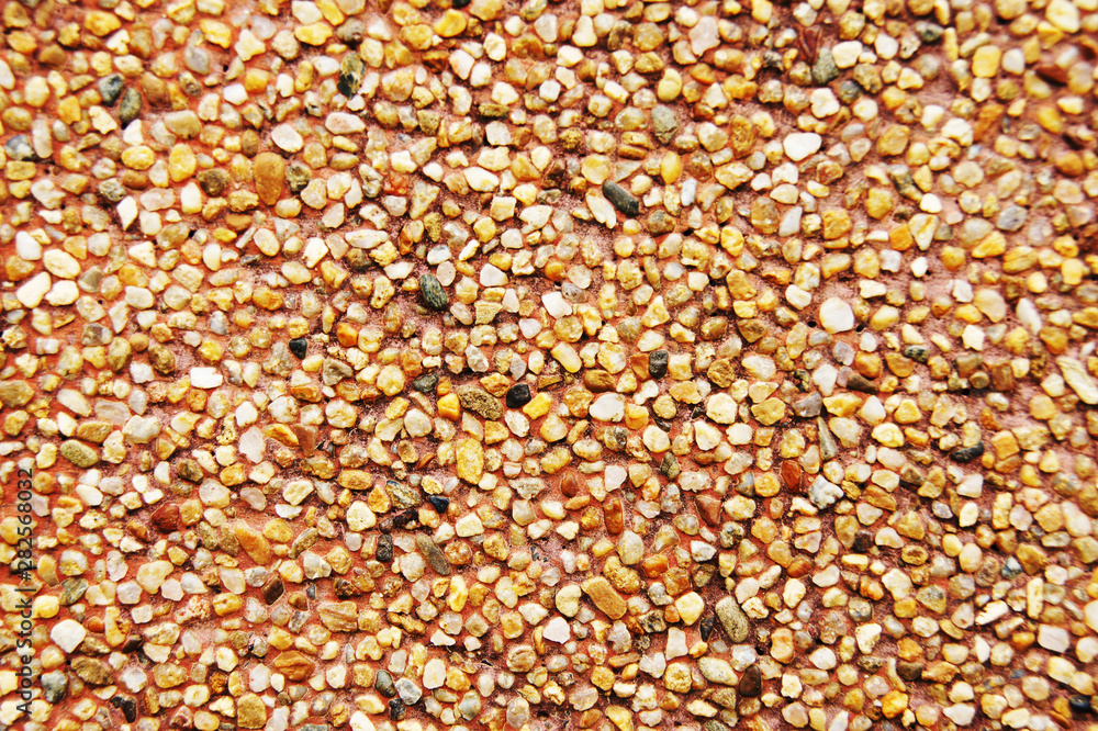 The background of the candle waxed with sand gravel The background of the candle waxed with sand gravel