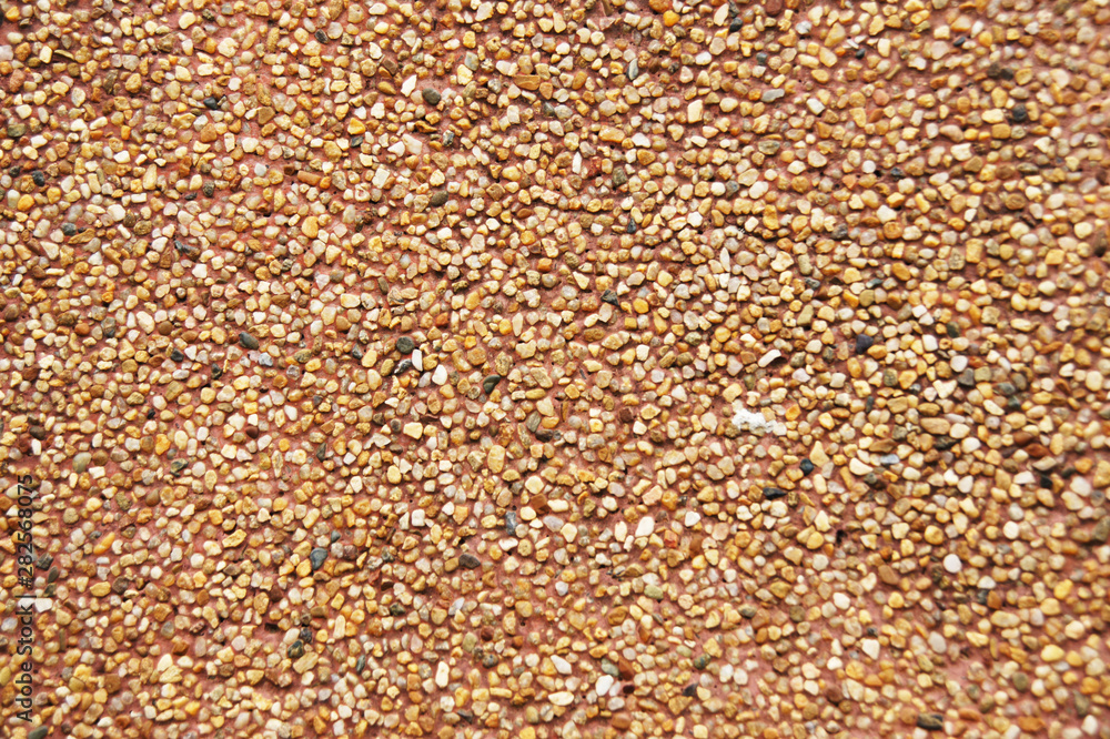 The background of the candle waxed with sand gravel The background of the candle waxed with sand gravel