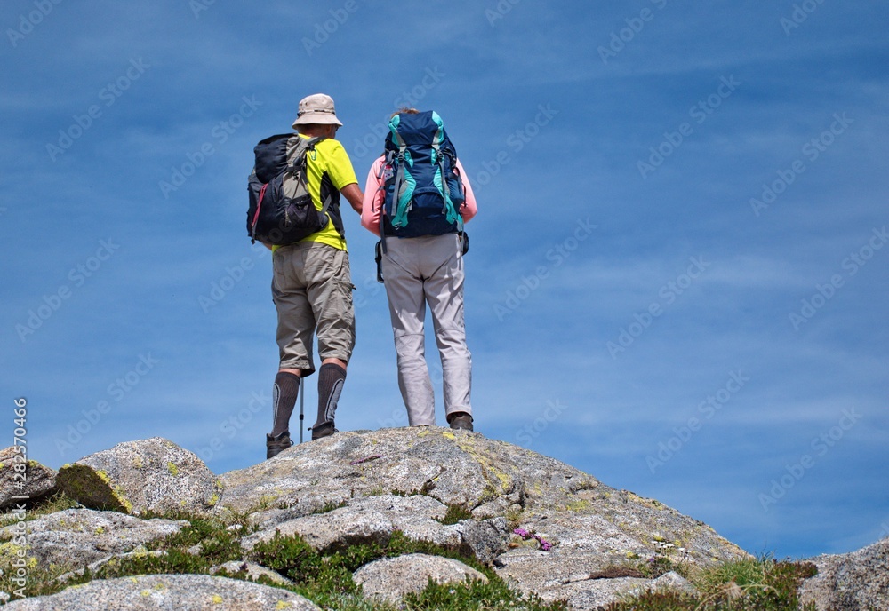 Low angle view of senior couple hiking in Dolomites