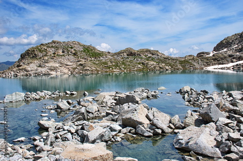 Scenic view of glacial lake in Brenta Dolomites with beautiful reflection of the rocks