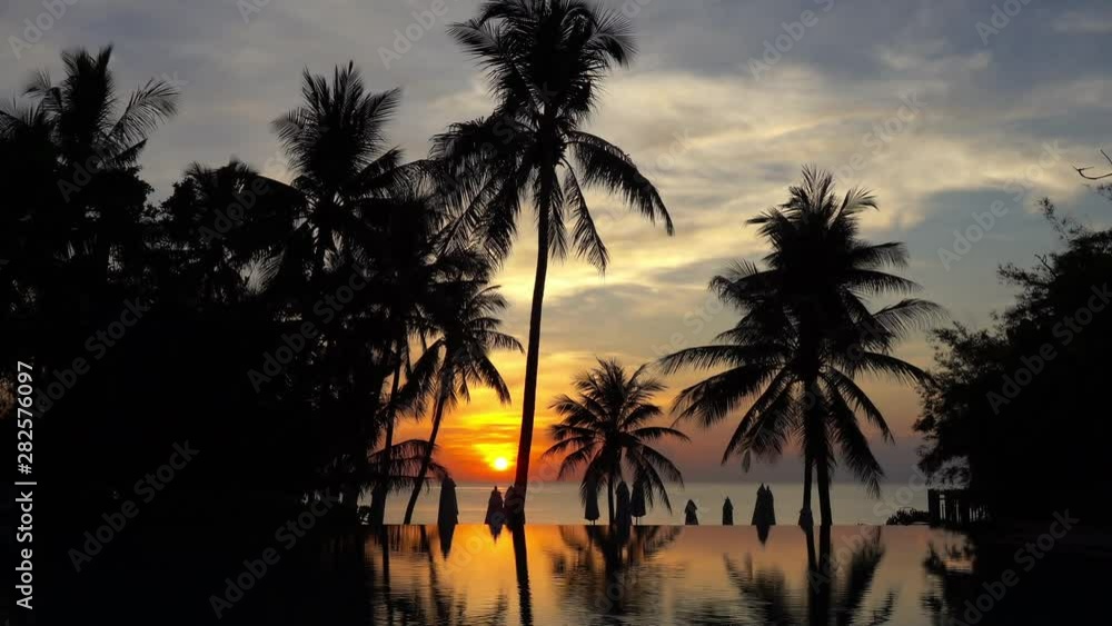 Sunrise reflecting on the infinity pool by the beach at Hua Hin Thailand Sunrise reflecting on the infinity pool by the beach at Hua Hin Thailand