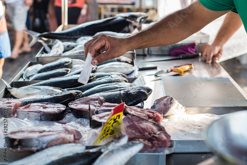 Fresh fish capture at traditional food market photo