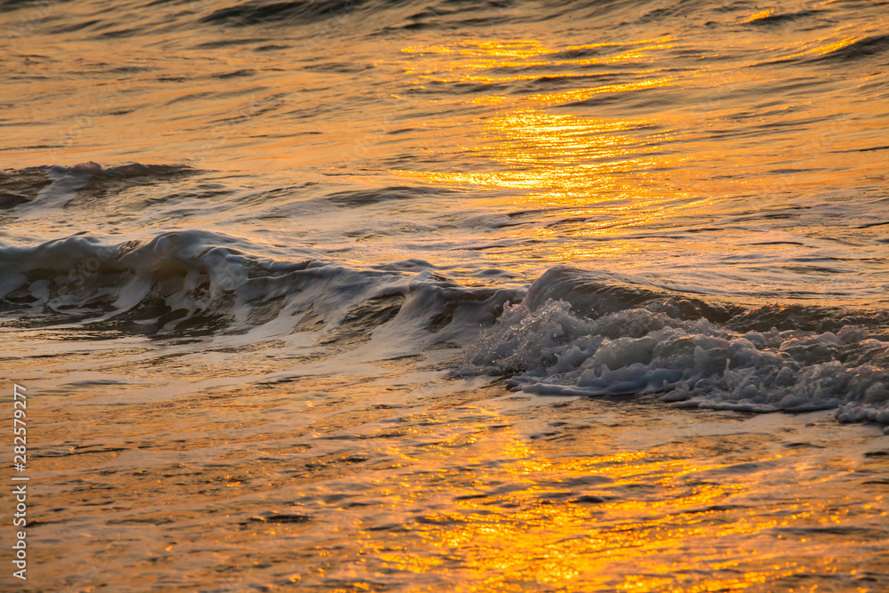 Beautiful sunset and sea wave