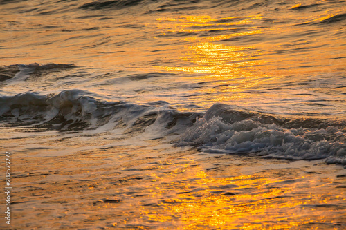 Beautiful sunset and sea wave
