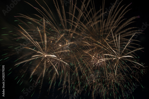 Colorful fireworks close up, fireworks explosion in dark sky. Free space for text. 