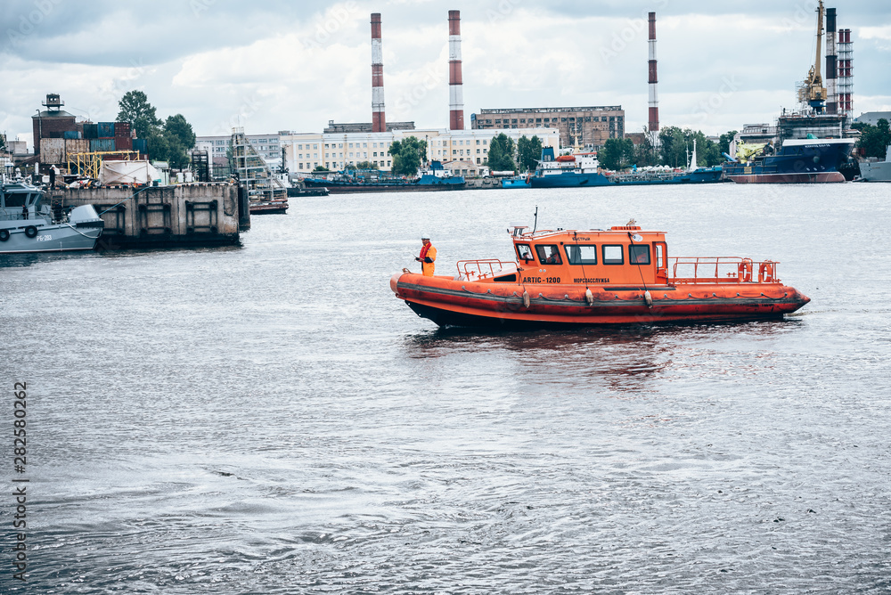 Saint Petersburg, Russia - July 30, 2019: the Doctrine on liquidation of oil spill in the sea port. Rescue service at work.