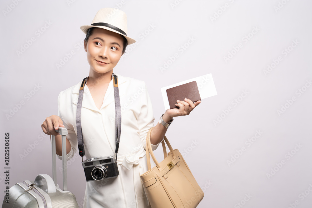 Tourist woman with suitcase isolated on white background Tourist woman with suitcase isolated on white background