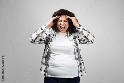 Stressed overweight woman o...