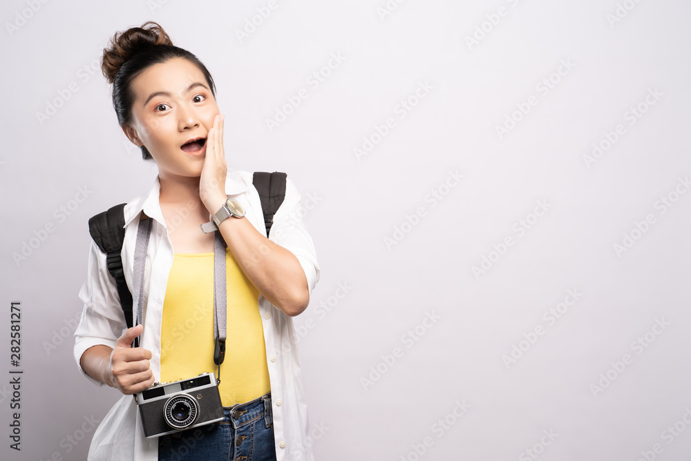 Happy woman holding camera and feel surprise over background Happy woman holding camera and feel surprise over background