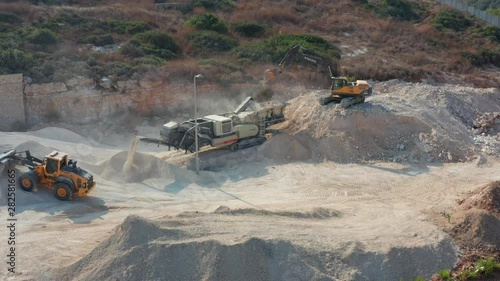 Machines are preparing a place to build a house. photo