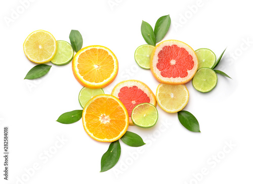Fototapeta Naklejka Na Ścianę i Meble -  Different sliced citrus fruits on white background