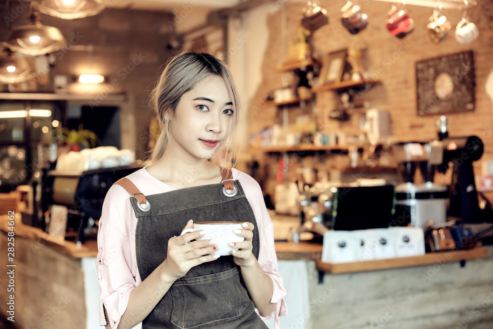 Asian Women Holding Coffee Cup  At Cafe