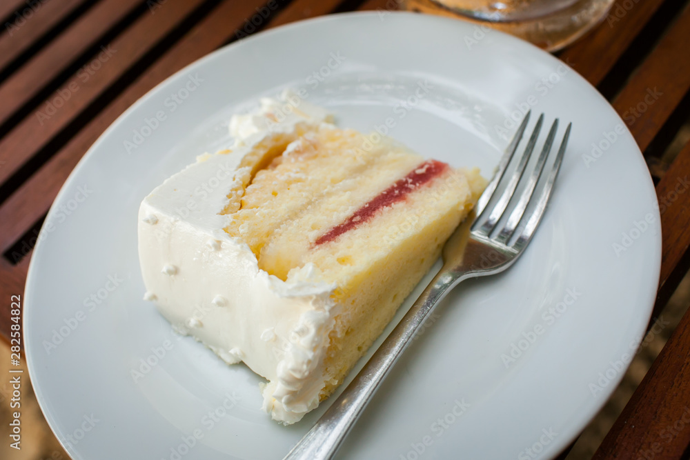 The wedding cake is cut into pieces. The wedding cake is cut into pieces.