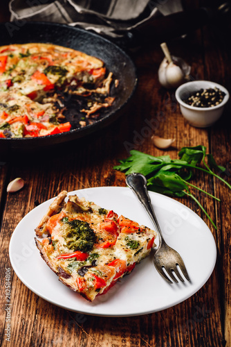 Vegetable frittata with broccoli and red bell pepper