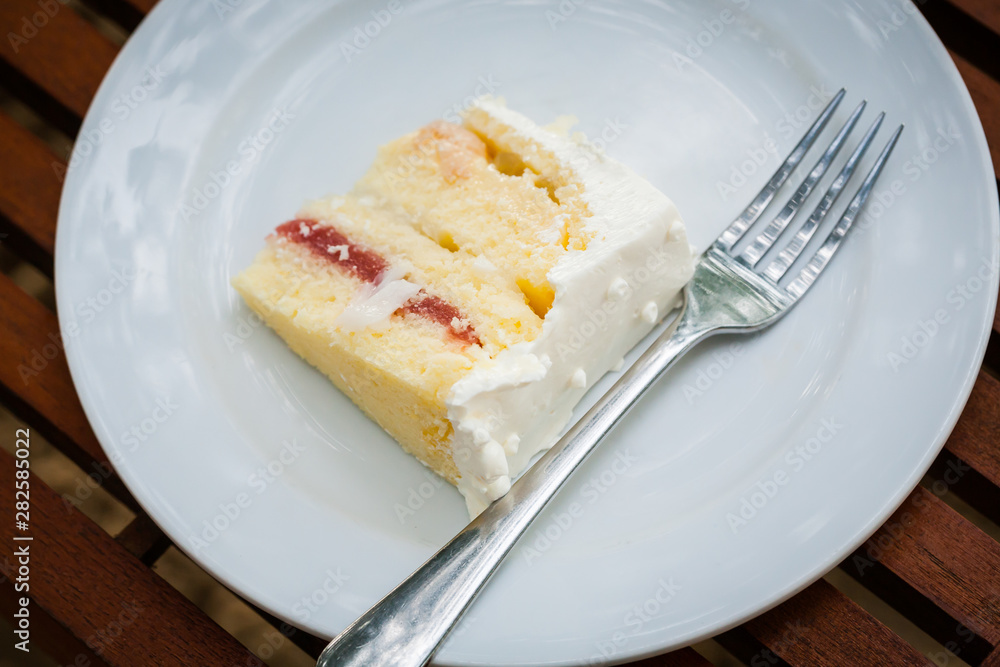 The wedding cake is cut into pieces. The wedding cake is cut into pieces.